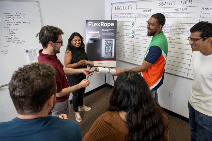 Aaron demonstrates FlexRope, one the products launched this year, during a team huddle Aaron demonstrates FlexRope, one the products launched this year, during a team huddle